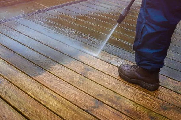 A patio being revitalised through pressure washing